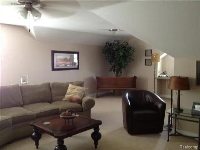 14922 Wildwood Dr, Monroe, MI 48161 - carpeted living room featuring a ceiling fan