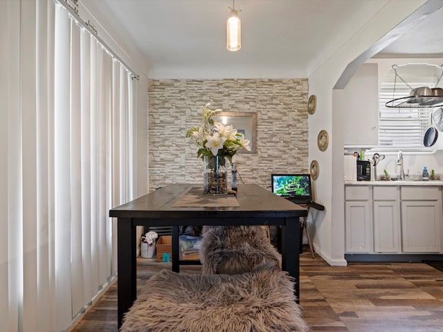 19400 Dwyer St, Detroit, MI 48234 - dining space featuring dark wood finished floors and arched walkways