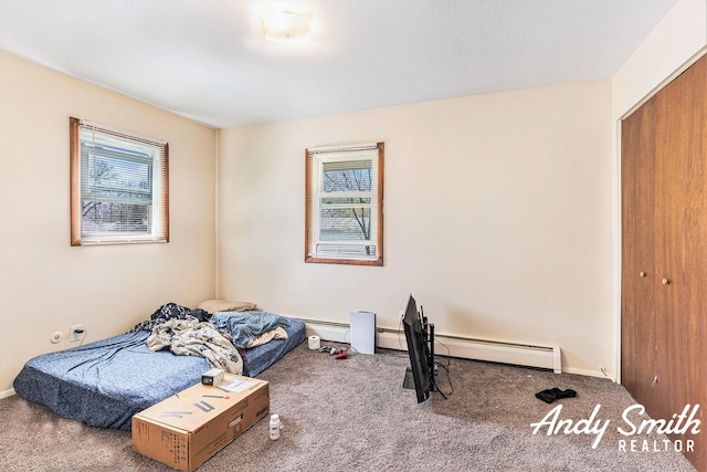 3817 Boone Ave SW, Wyoming, MI 49519 - bedroom featuring a closet, carpet flooring, baseboards, and a baseboard radiator