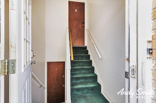 3817 Boone Ave SW, Wyoming, MI 49519 - staircase featuring baseboards