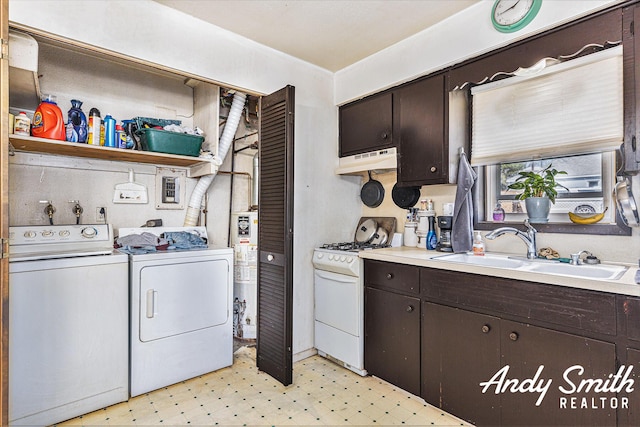 3817 Boone Ave SW, Wyoming, MI 49519 - clothes washing area featuring a sink, washer and clothes dryer, laundry area, water heater, and light floors