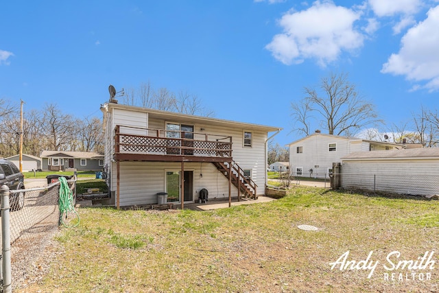 3817 Boone Ave SW, Wyoming, MI 49519 - rear view of property with fence, a yard, stairs, and a wooden deck