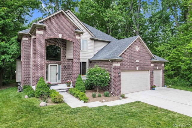 50477 Edith St, Chesterfield, MI 48047 - traditional-style home with an attached garage, concrete driveway, brick siding, and a front yard