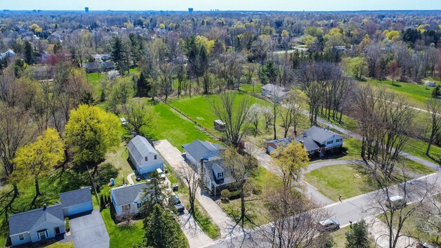 birds eye view of property with a residential view and a forest view