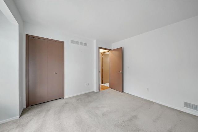 29691 Sierra Pointe Cir, Farmington Hills, MI 48331 - unfurnished bedroom featuring light colored carpet, baseboards, visible vents, and a closet