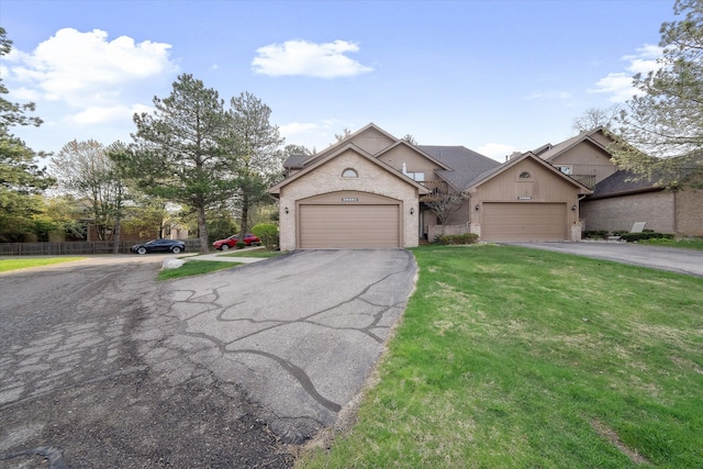 29691 Sierra Pointe Cir, Farmington Hills, MI 48331 - view of front of house featuring an attached garage, brick siding, aphalt driveway, and a front yard