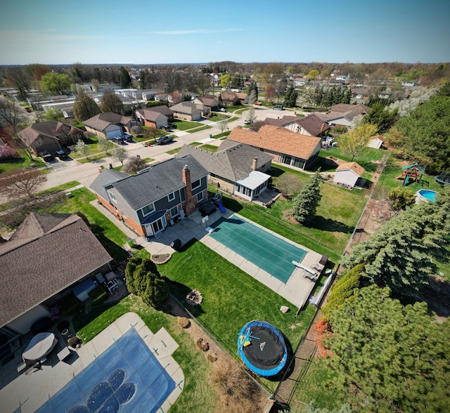 birds eye view of property with a residential view