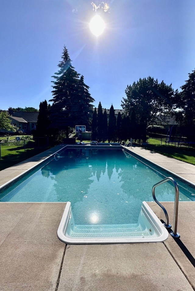 view of swimming pool featuring fence and a fenced in pool