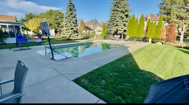 view of swimming pool with a fenced in pool, a yard, a patio area, and fence