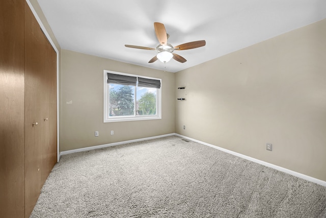 unfurnished bedroom featuring visible vents, baseboards, carpet flooring, and a closet