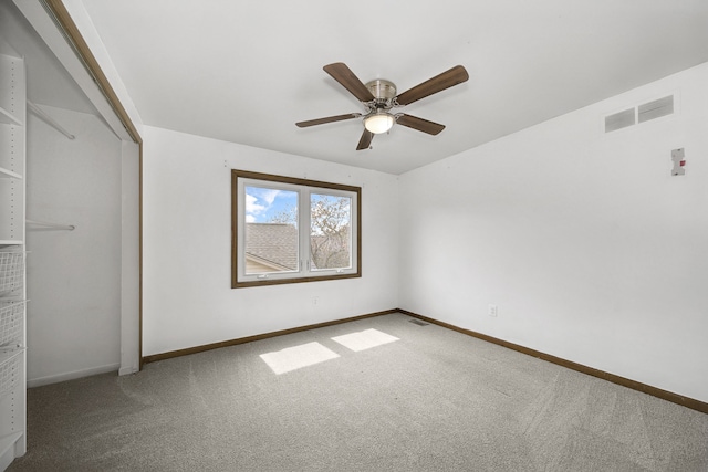 unfurnished bedroom featuring visible vents, ceiling fan, carpet flooring, and baseboards