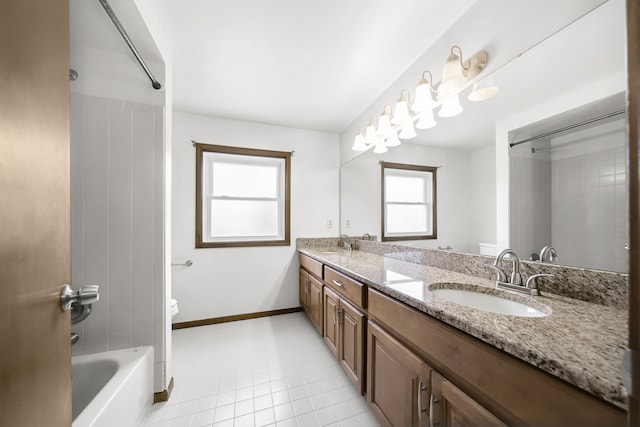 full bathroom with toilet, shower / tub combination, double vanity, and a sink
