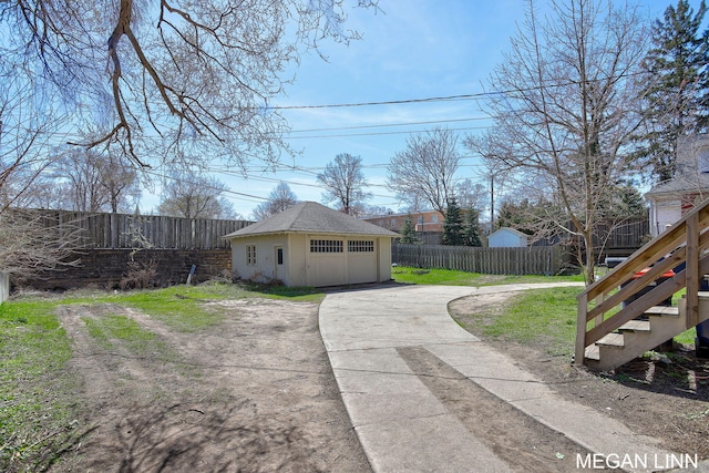 186 W 12th St, Holland, MI 49423 - exterior space with an outbuilding, a lawn, stairs, and fence private yard