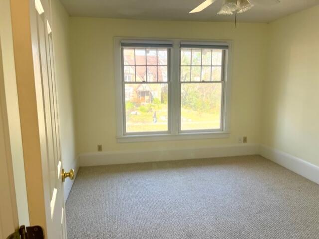 186 W 12th St, Holland, MI 49423 - unfurnished room featuring a ceiling fan, carpet, and baseboards
