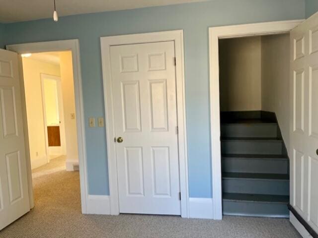 186 W 12th St, Holland, MI 49423 - stairs featuring carpet and baseboards