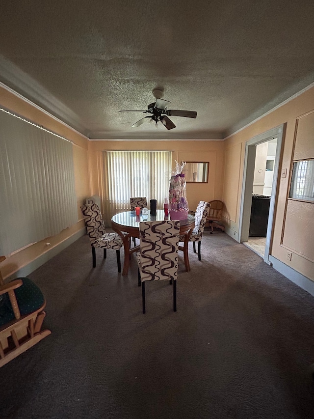 carpeted dining room featuring a textured ceiling and ceiling fan