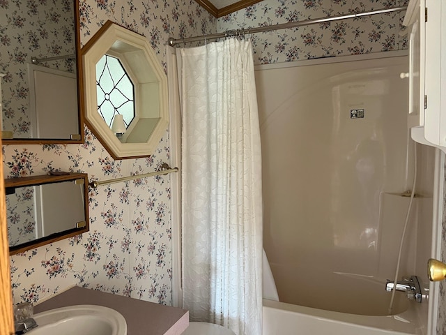 full bath with shower / bathtub combination with curtain, wallpapered walls, toilet, and a sink