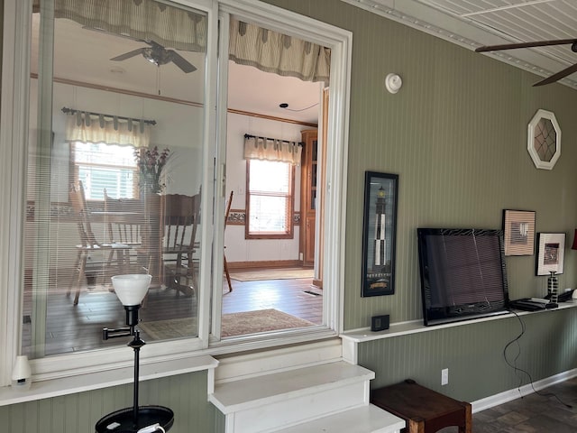 interior space featuring ceiling fan