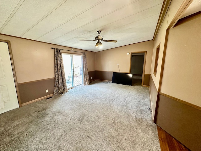 1088 Kern Rd, Fowlerville, MI 48836 - unfurnished living room featuring carpet floors and a ceiling fan