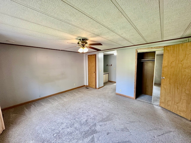 1088 Kern Rd, Fowlerville, MI 48836 - unfurnished bedroom with carpet flooring, a ceiling fan, and baseboards