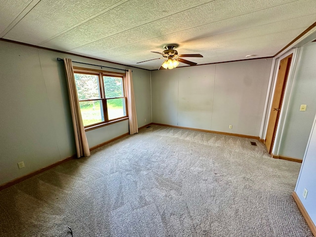 1088 Kern Rd, Fowlerville, MI 48836 - unfurnished room with light carpet, a ceiling fan, baseboards, and a textured ceiling