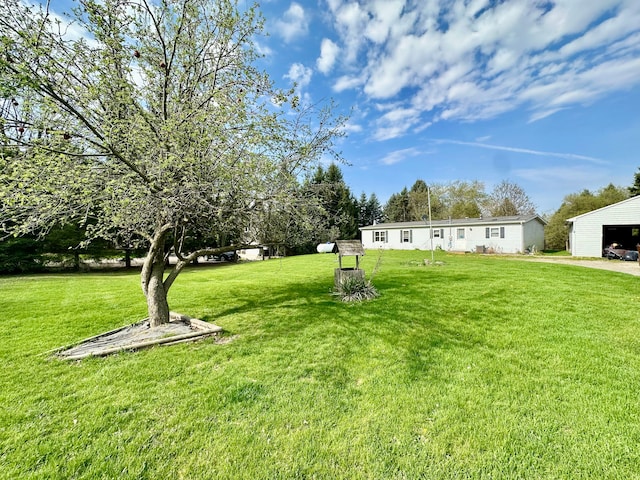 1088 Kern Rd, Fowlerville, MI 48836 - view of green lawn featuring an outbuilding