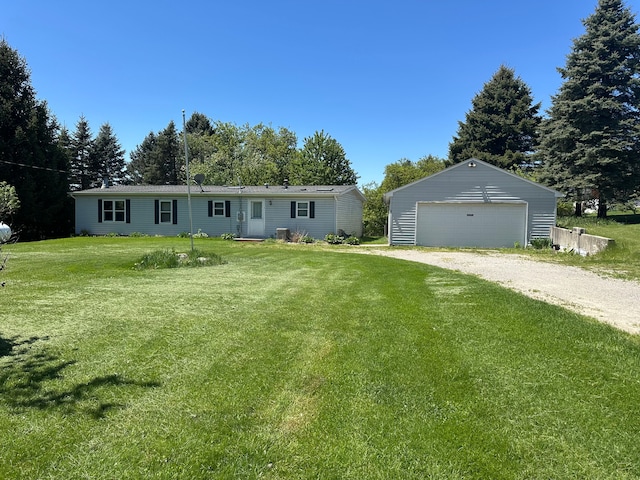 1088 Kern Rd, Fowlerville, MI 48836 - manufactured / mobile home featuring a detached garage, an outbuilding, and a front yard