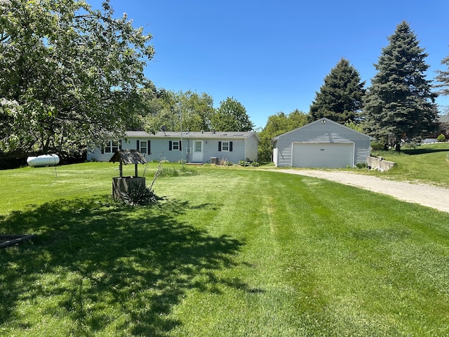 1088 Kern Rd, Fowlerville, MI 48836 - manufactured / mobile home with a detached garage, an outdoor structure, and a front yard