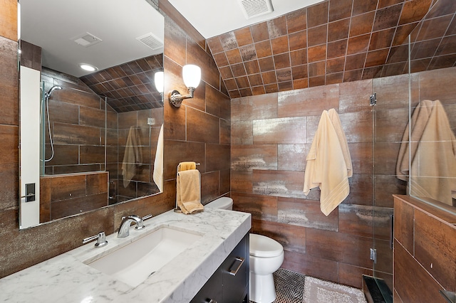 1011 Pierce St, Birmingham, MI 48009 - bathroom featuring lofted ceiling, toilet, vanity, visible vents, and a stall shower