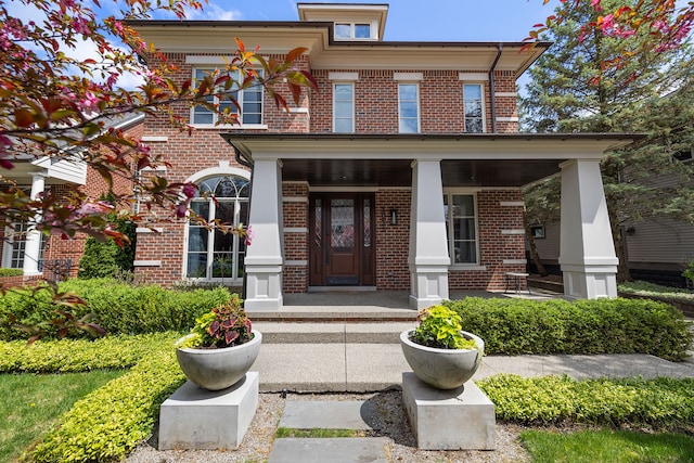 1011 Pierce St, Birmingham, MI 48009 - view of front of home featuring a porch and brick siding