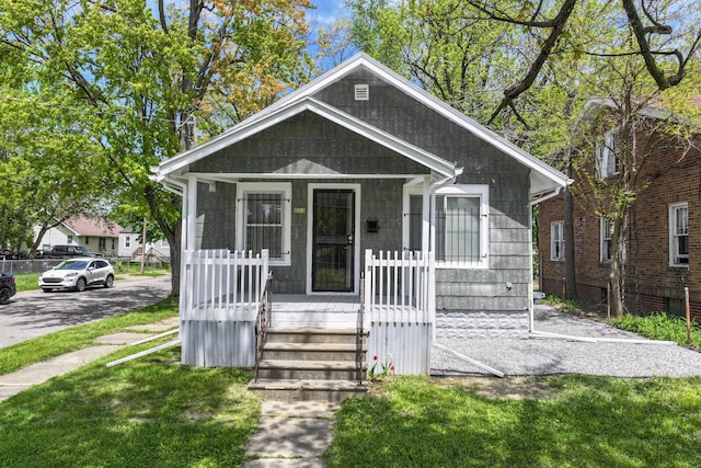 203 E Stewart Ave, Flint, MI 48505 - view of front of property featuring a porch and a front yard