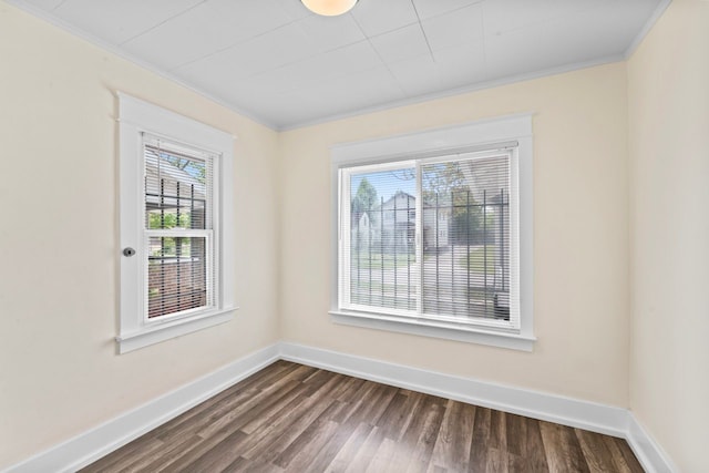 203 E Stewart Ave, Flint, MI 48505 - unfurnished room featuring crown molding, dark wood-type flooring, and baseboards