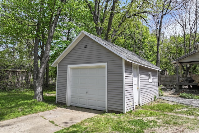 203 E Stewart Ave, Flint, MI 48505 - detached garage featuring concrete driveway