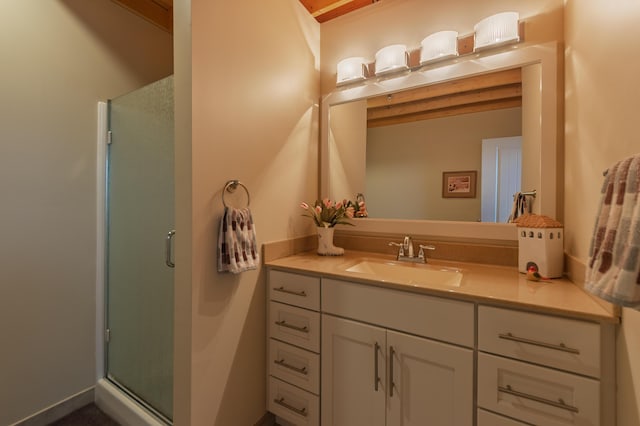 full bath featuring vanity and a shower stall
