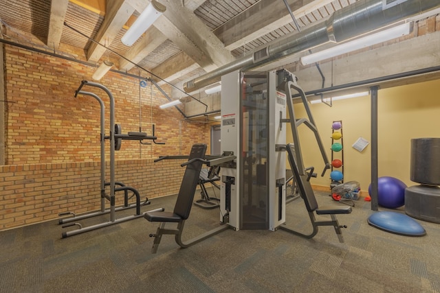 workout area with brick wall