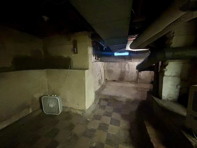 unfinished basement featuring tile patterned floors