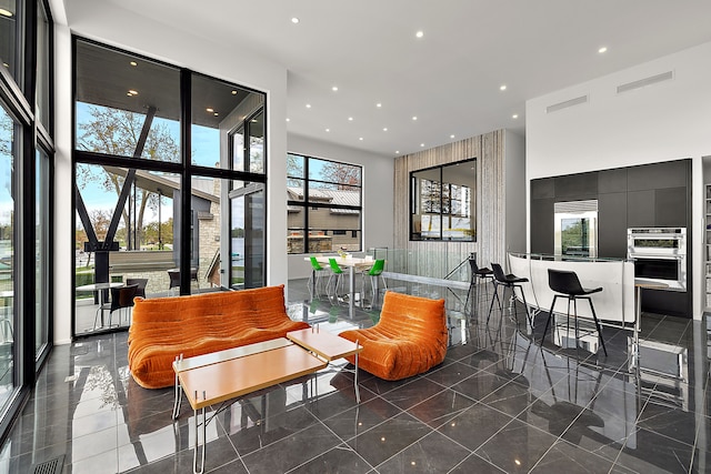 lobby featuring a high ceiling and recessed lighting
