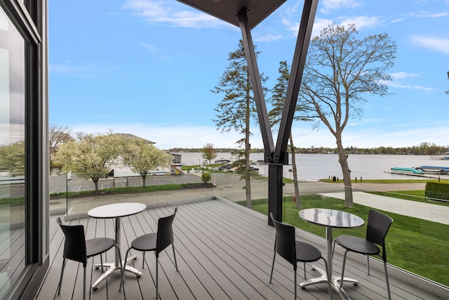 wooden terrace with a water view