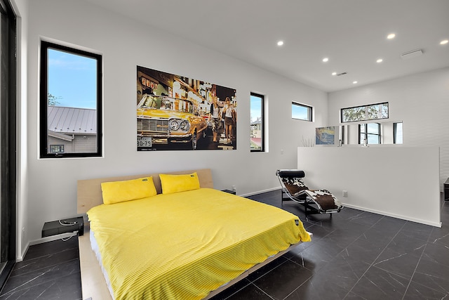 bedroom with recessed lighting and baseboards
