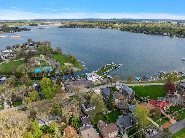 view of property location with a nearby body of water and nearby suburban area