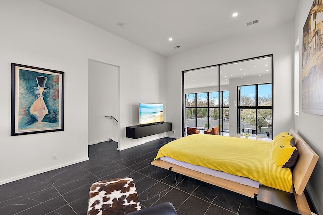 bedroom with recessed lighting, baseboards, and a towering ceiling