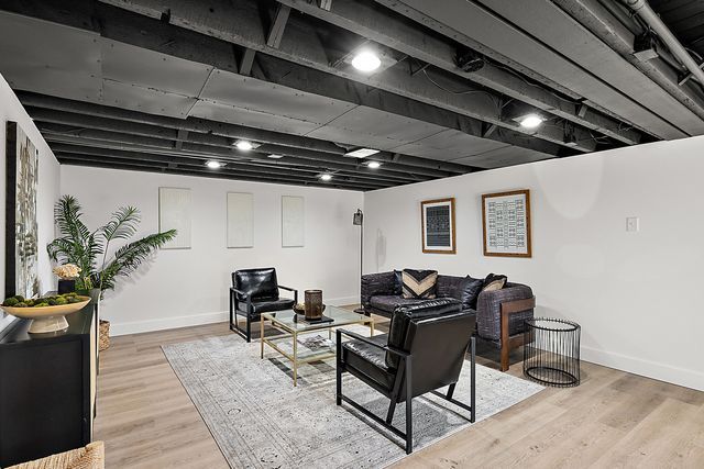 2423 Chicago Blvd, Detroit, MI 48206 - living room featuring baseboards and wood finished floors
