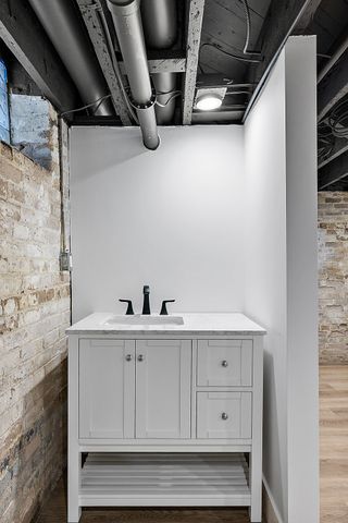 2423 Chicago Blvd, Detroit, MI 48206 - interior space featuring wood finished floors and vanity