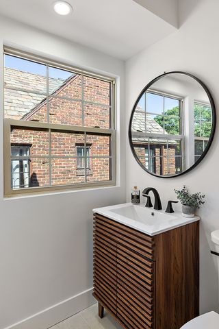 2423 Chicago Blvd, Detroit, MI 48206 - half bathroom featuring baseboards, toilet, recessed lighting, vanity, and tile patterned flooring