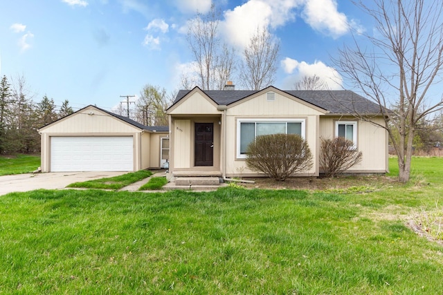 view of front of home with a garage, driveway, and a front yard