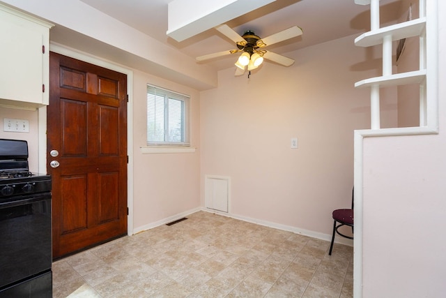 interior space featuring a ceiling fan, baseboards, and visible vents