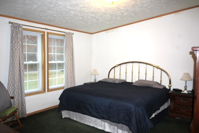 carpeted bedroom with ornamental molding and a textured ceiling
