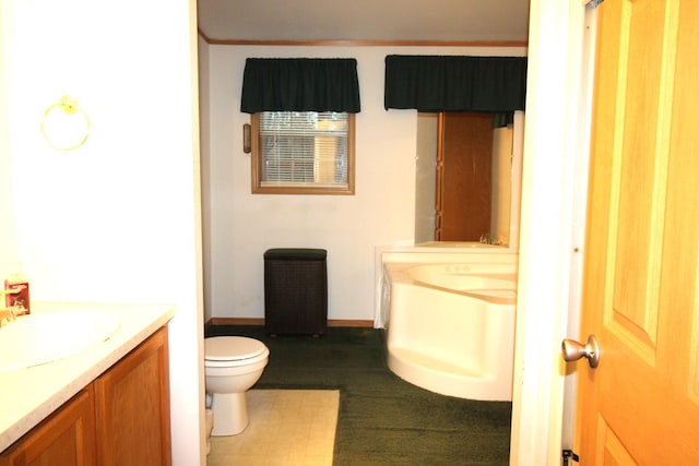 bathroom featuring toilet and vanity