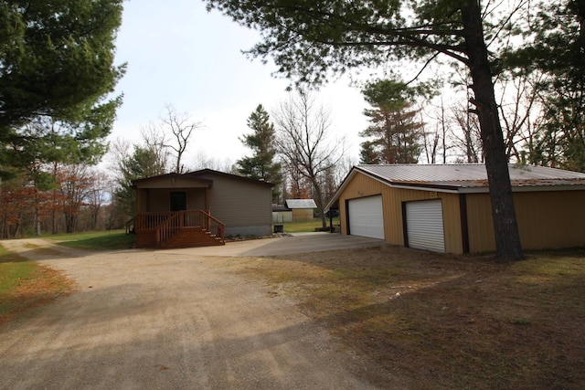 detached garage featuring driveway