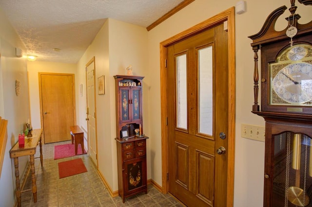 1414 Plains Rd, Leslie, MI 49251 - foyer entrance with a textured ceiling, tile patterned floors, and baseboards
